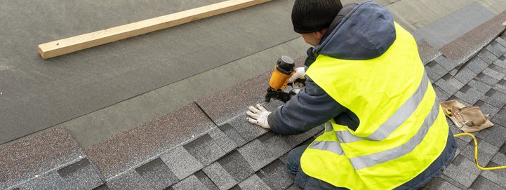 Roofing Contractor Replacing Shingles