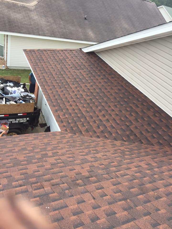 Closeup of brown asphalt roof shingles installed on a house