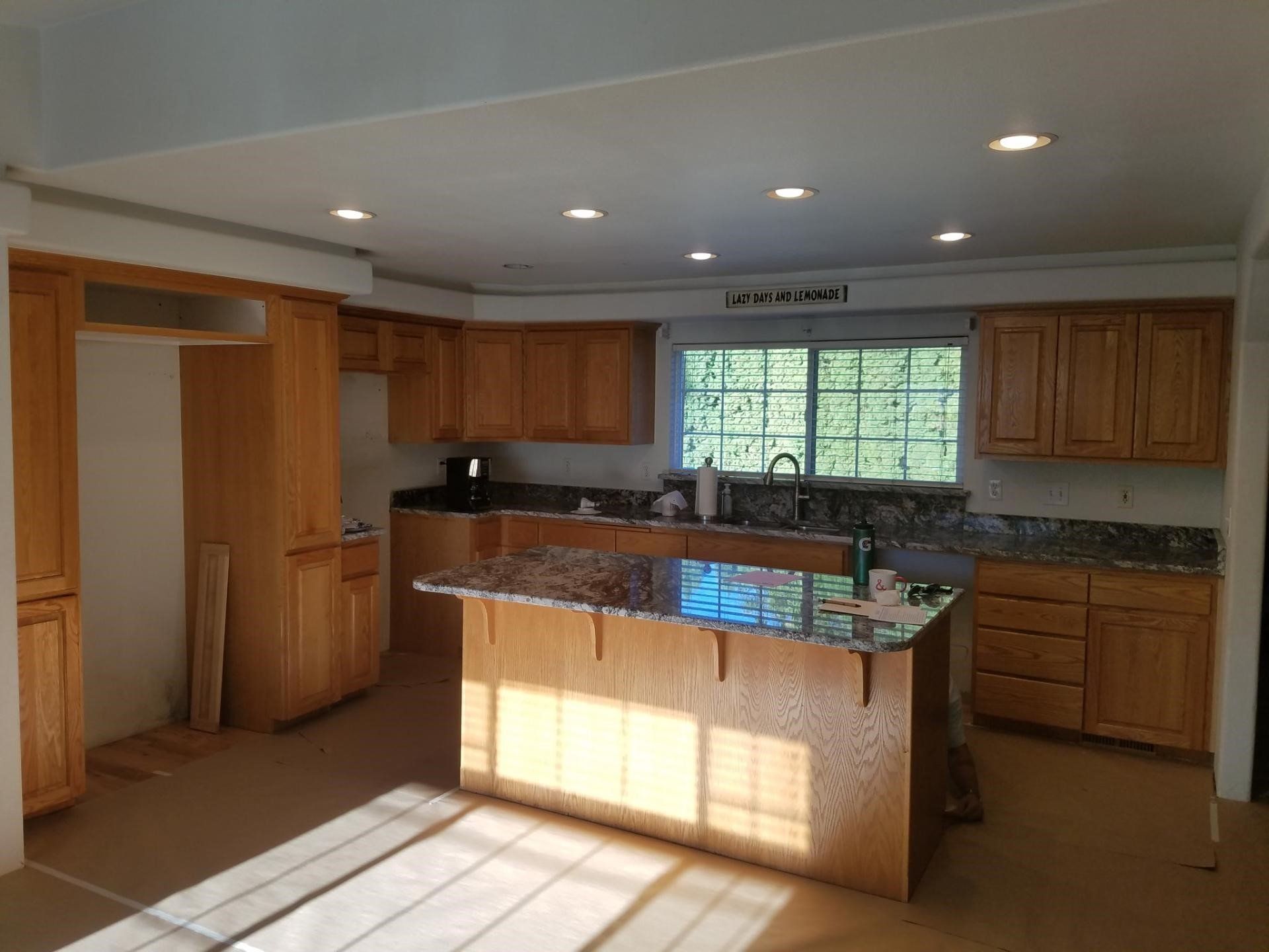 A Kitchen With Wooden Cabinets - Albany, OR - LDN Painters, Inc.