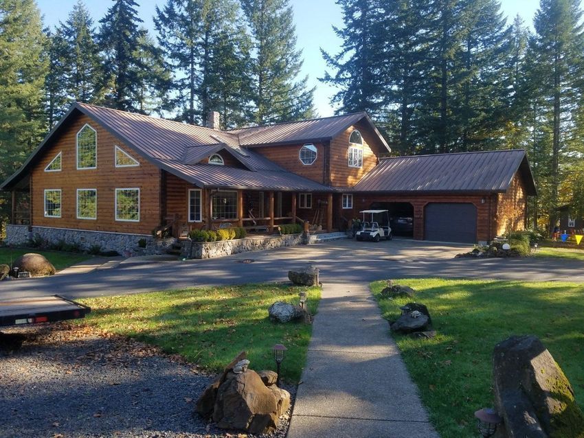 A Large House With a Golf Cart Parked in Front of It - Albany, OR - LDN Painters, Inc.