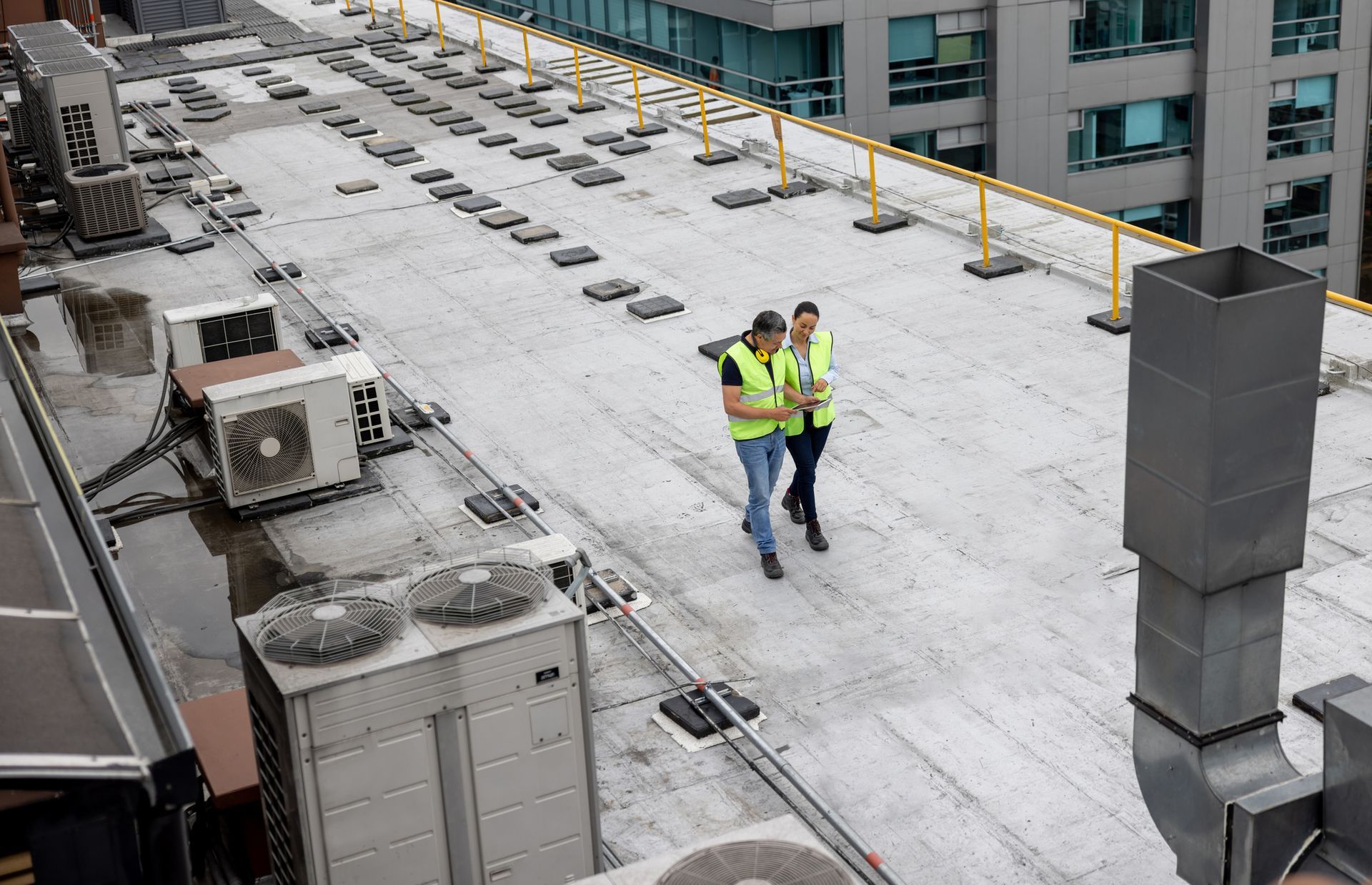 Two construction workers are working on a building under construction.