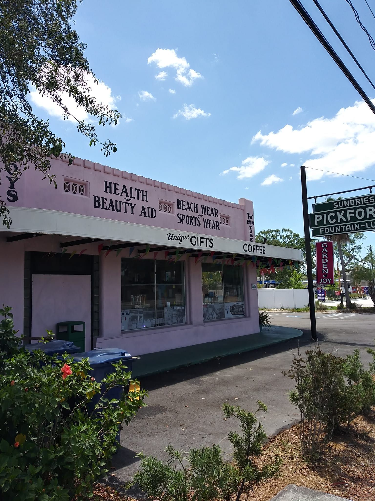 A pink building with the word beauty on it