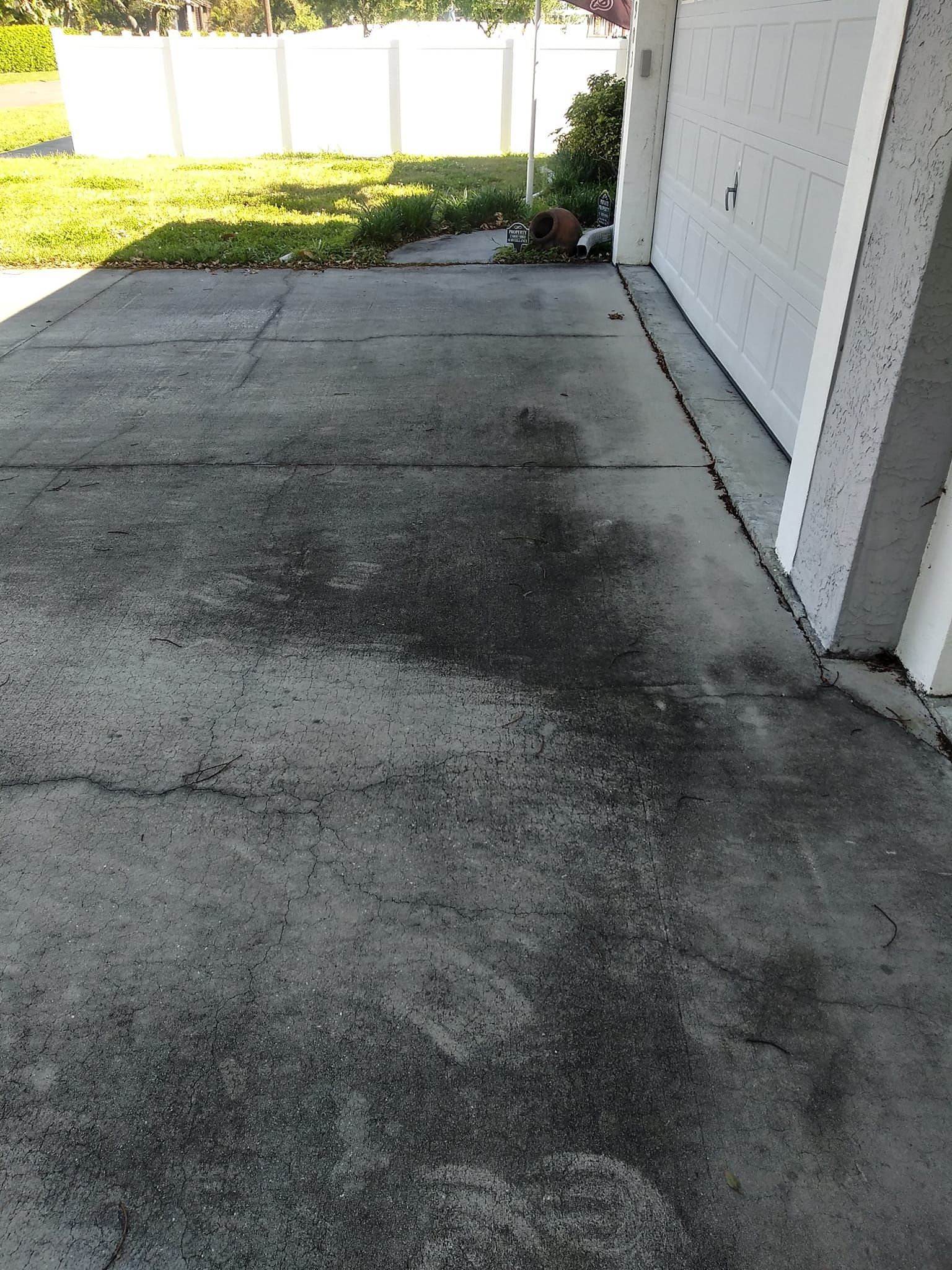 dirty driveway before pressure washing