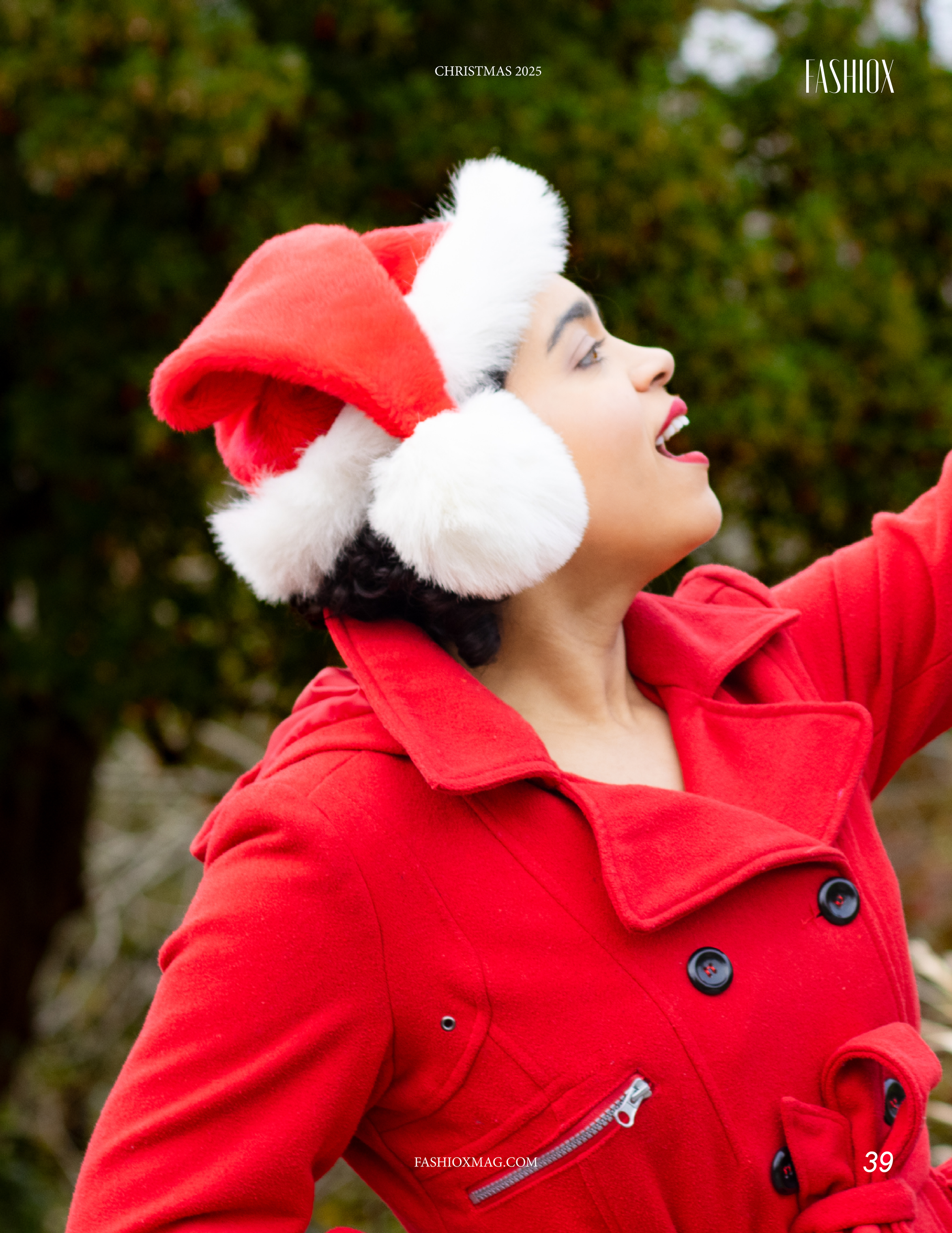 Holiday fashion editorial portrait of model Irene Ramos in a red coat and Santa hat for Fashiox Magazine December issue.