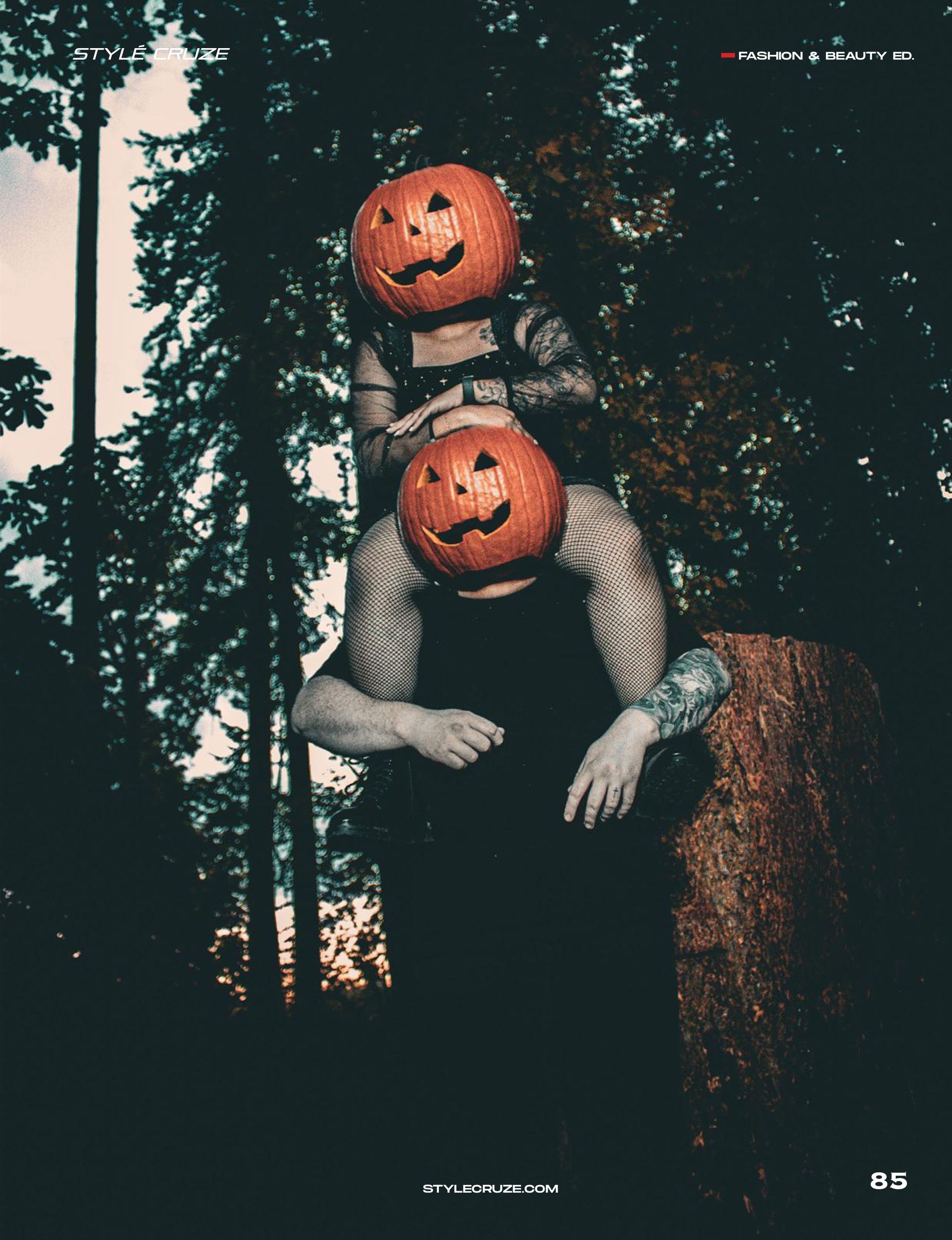 Couple wearing carved pumpkin heads posing in Pioneer Park, Stayton Oregon, during a spooky fall editorial photoshoot by Verity Visions. Featured in StyleCruze Magazine 2025.