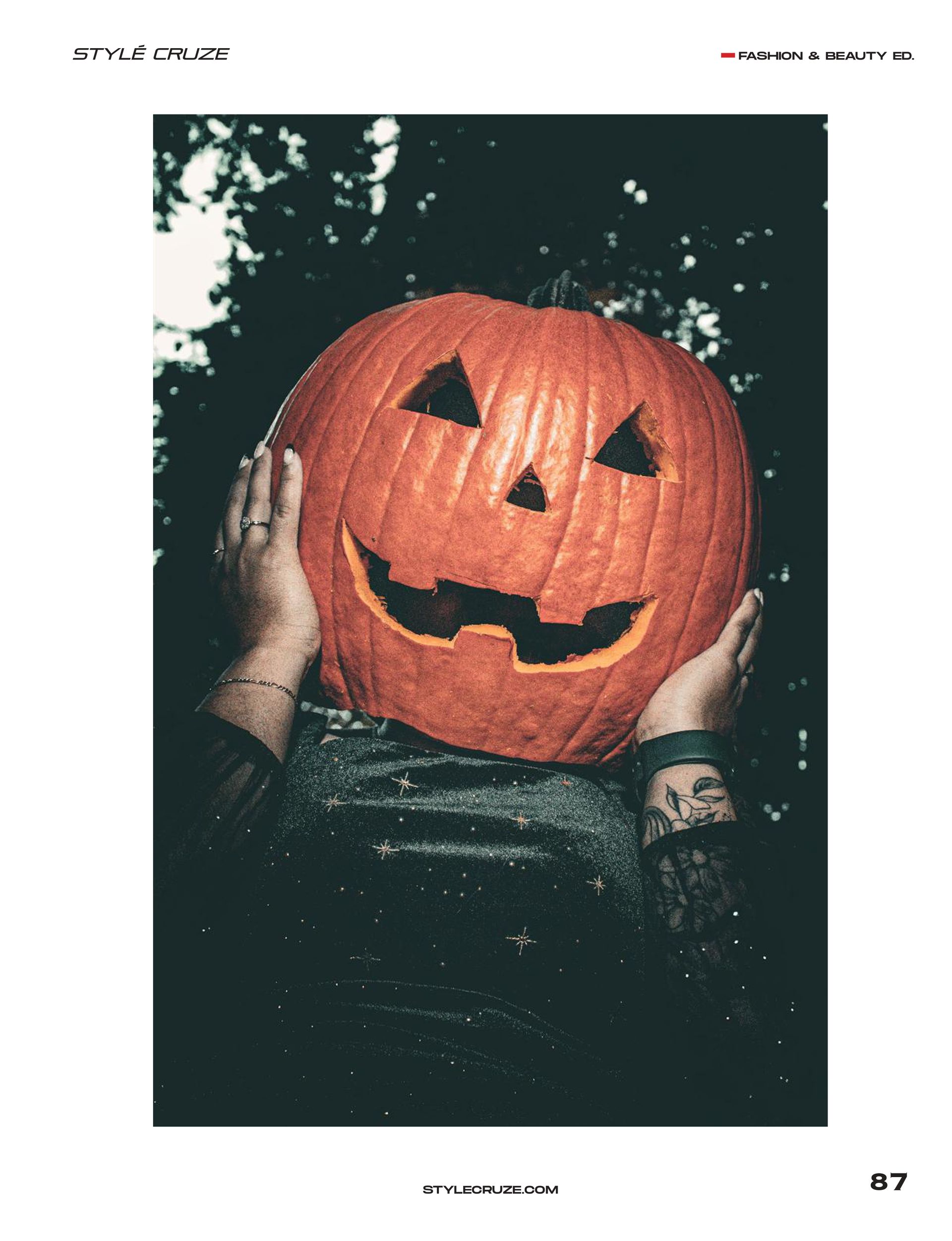 Couple wearing carved pumpkin heads posing in Pioneer Park, Stayton Oregon, during a spooky fall editorial photoshoot by Verity Visions. Featured in StyleCruze Magazine 2025.