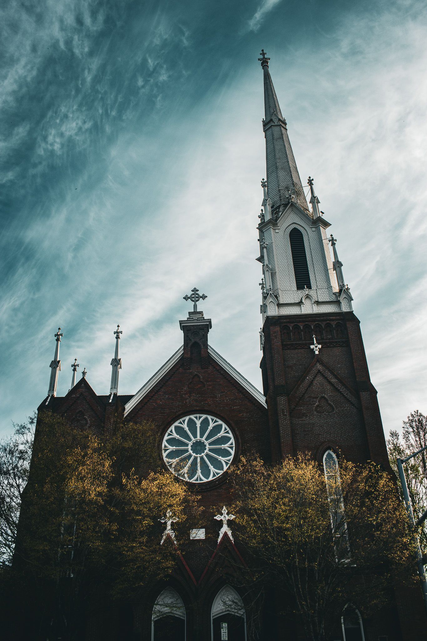 Tall spire of Salem First United Methodist Church rising above downtown Salem Oregon, showcasing historic Gothic Revival church architecture.