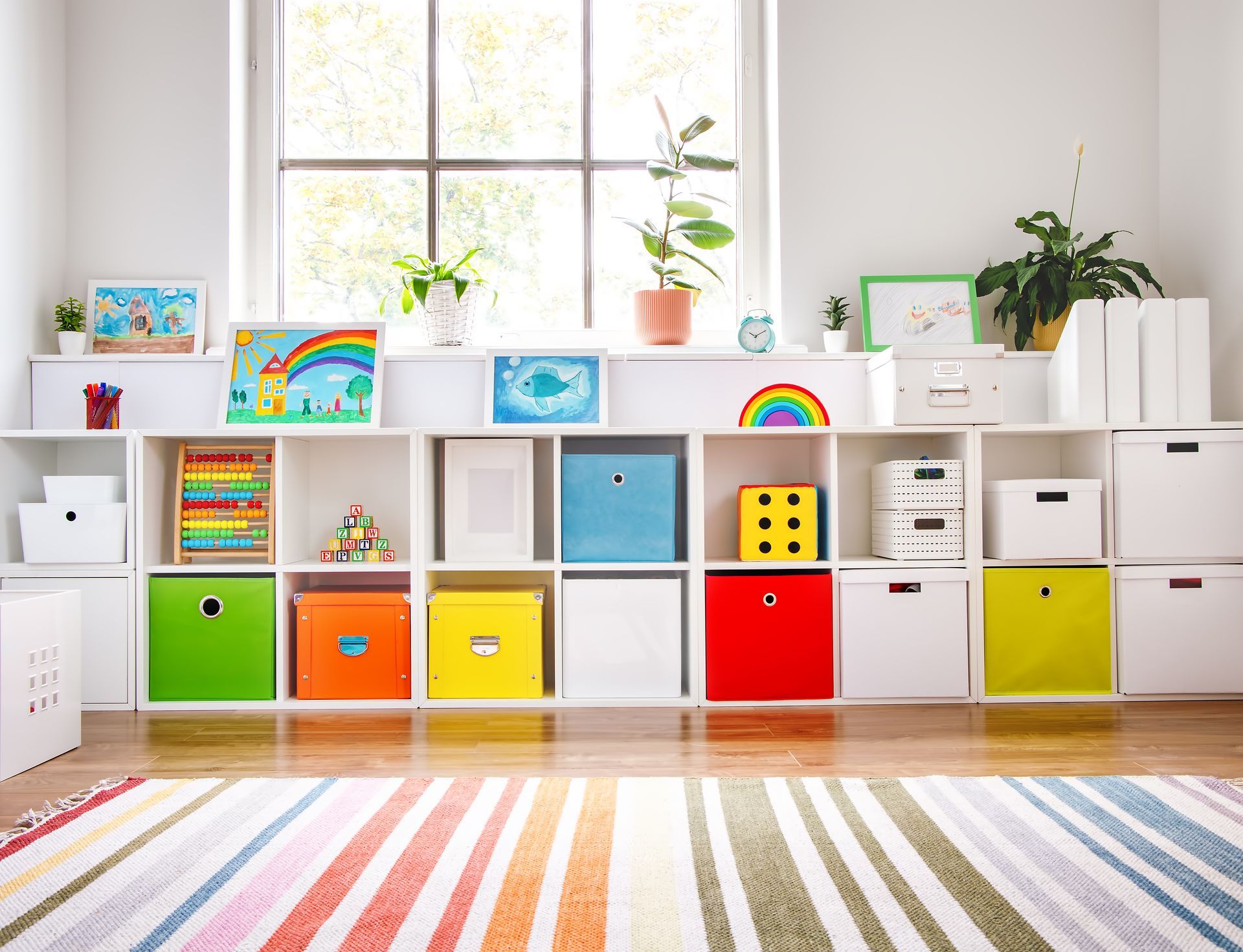 Children's playroom with custom white cabinets