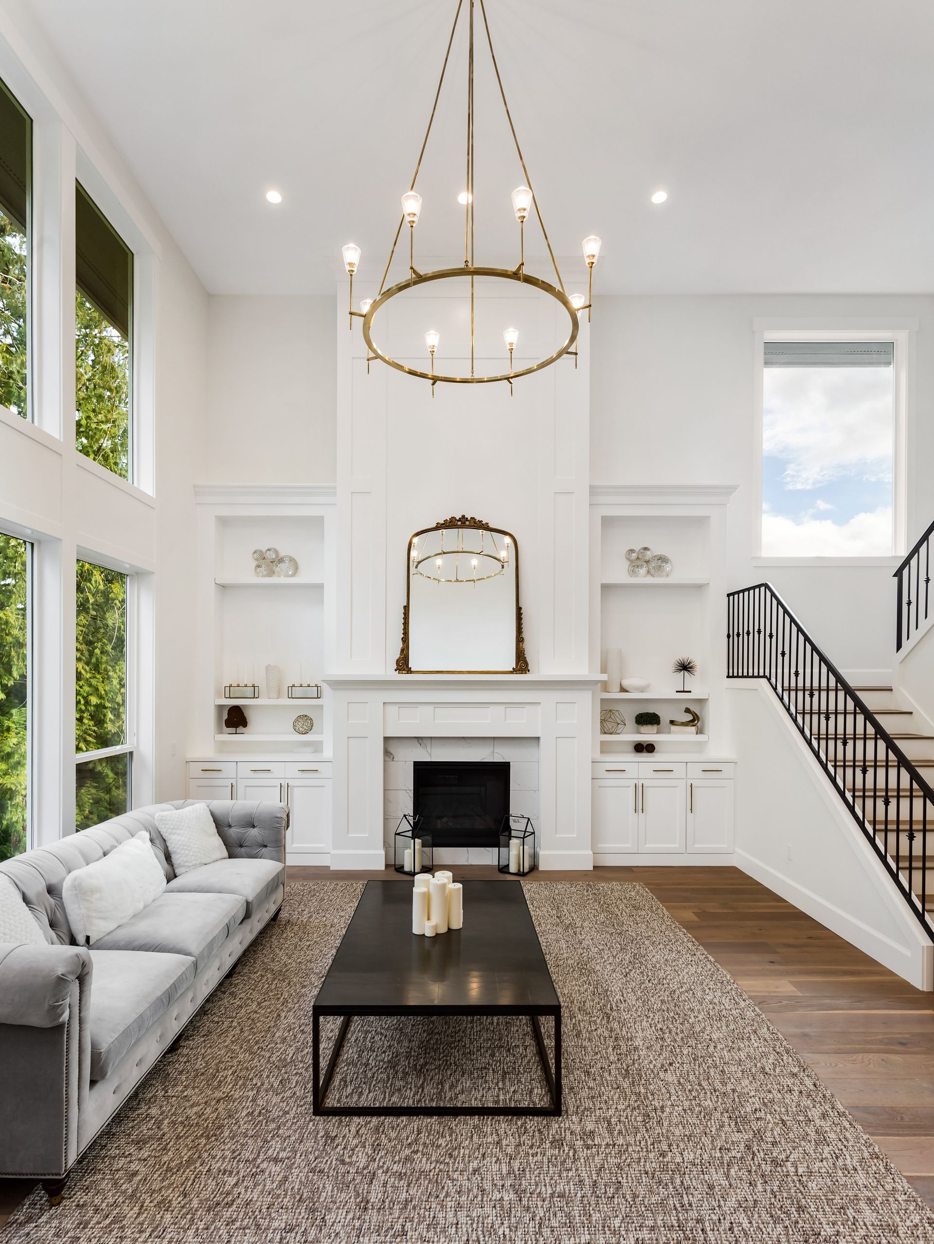 White colored living room with chandelier