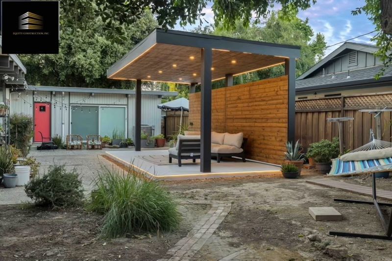Backyard with modern wooden pergola, seating, and string lights.