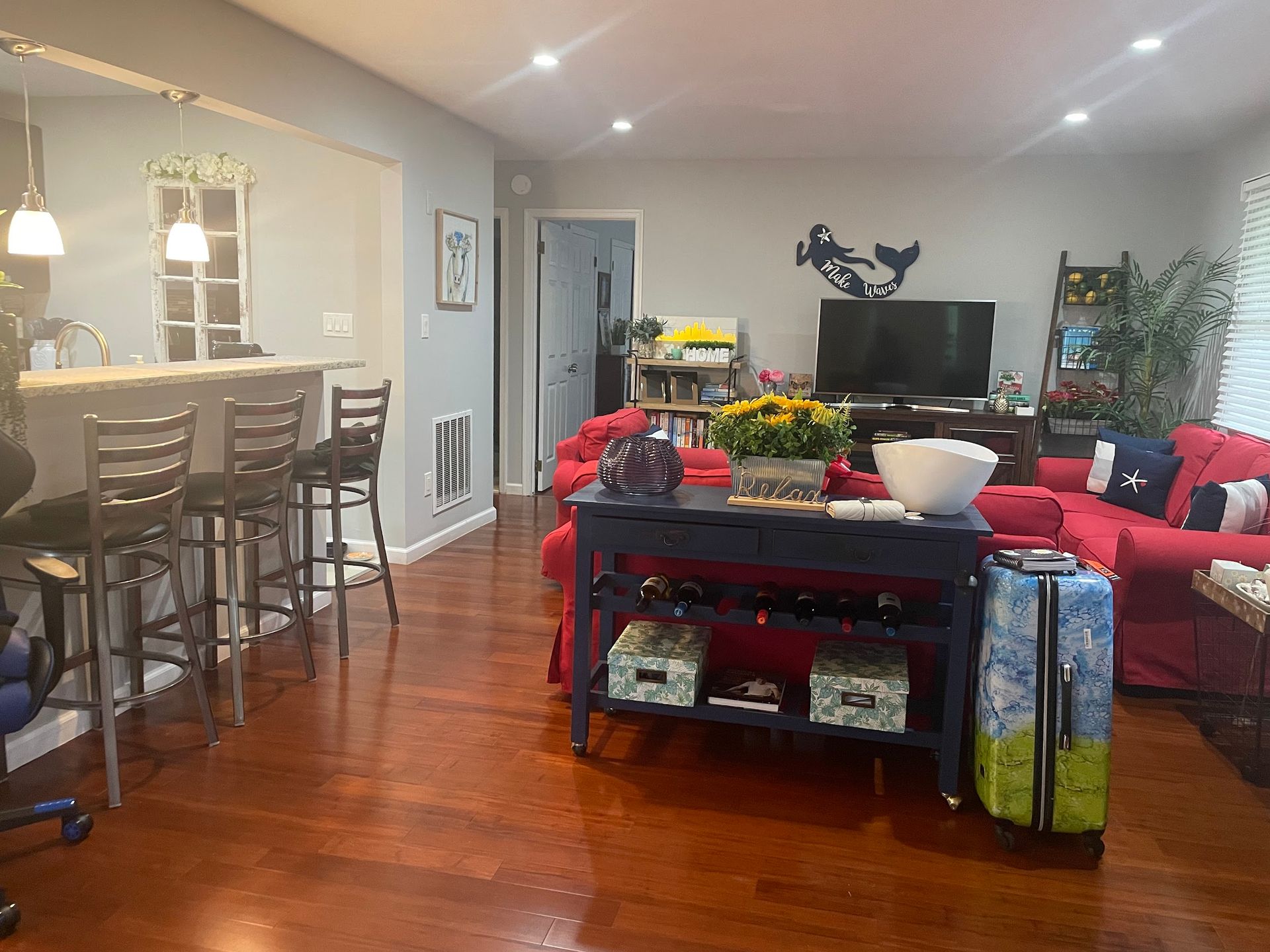 A living room filled with furniture and a television.