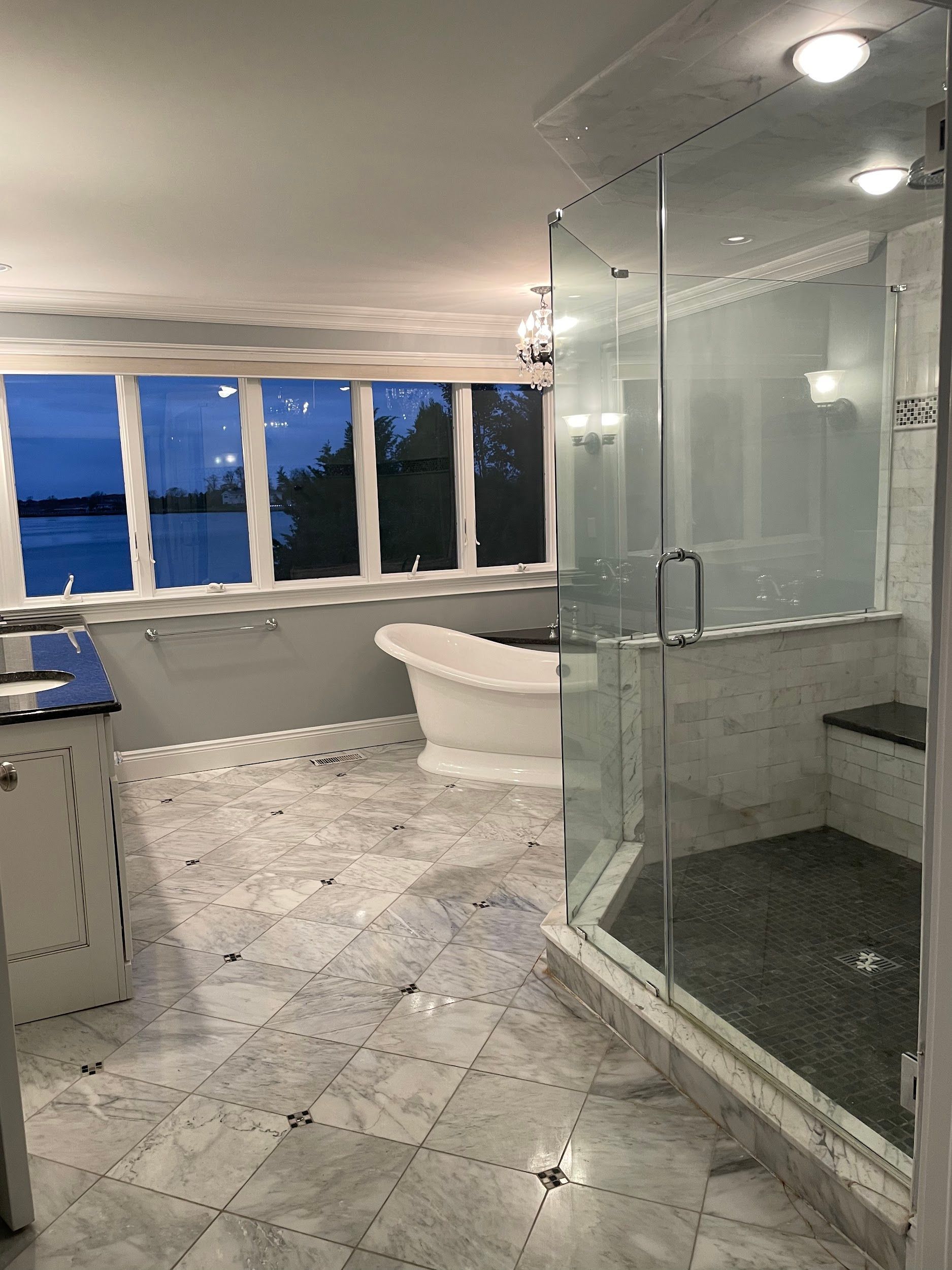 A bathroom with a bathtub and a walk in shower.