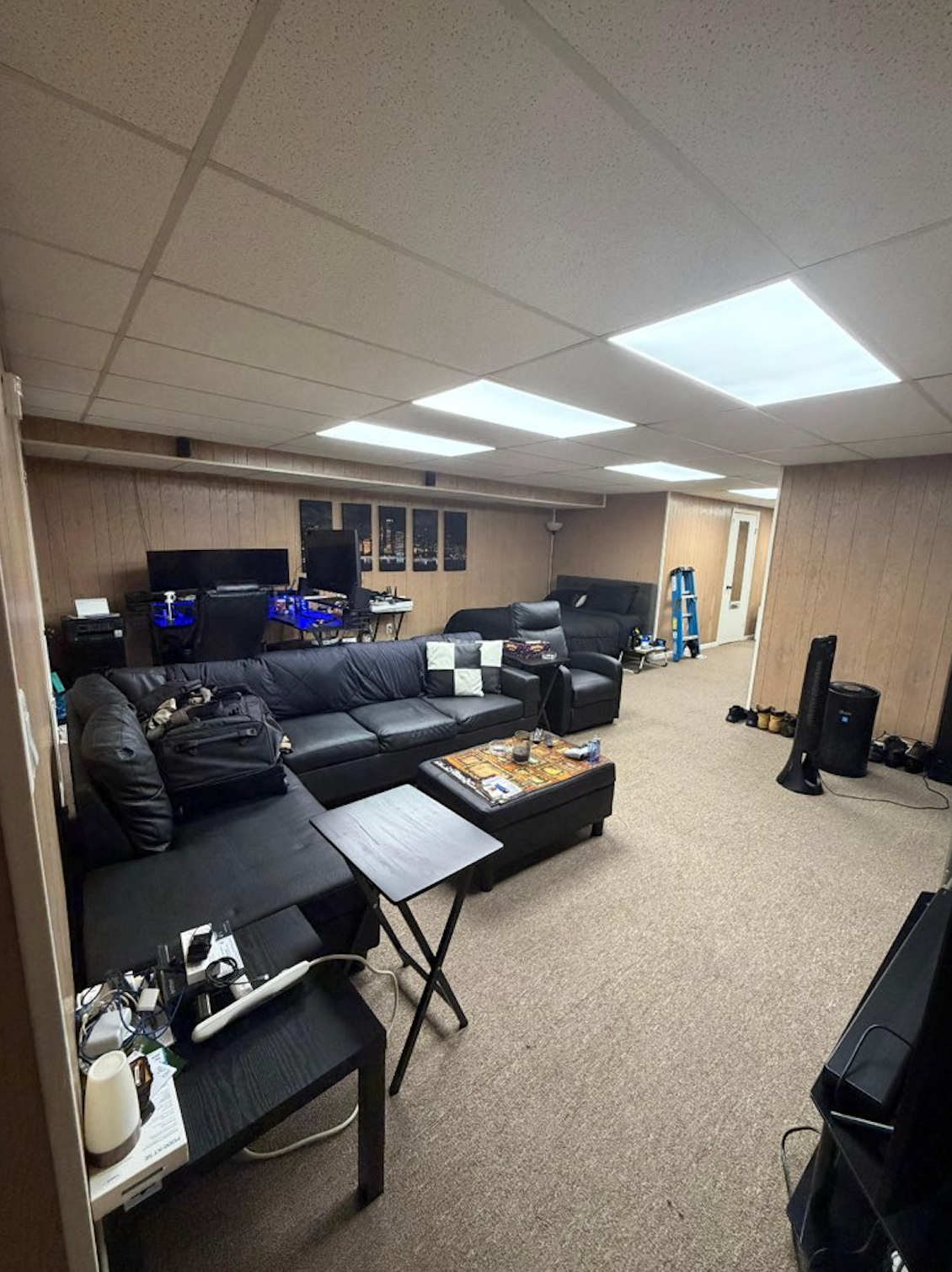A white bathtub is sitting on a tiled floor in a bathroom.