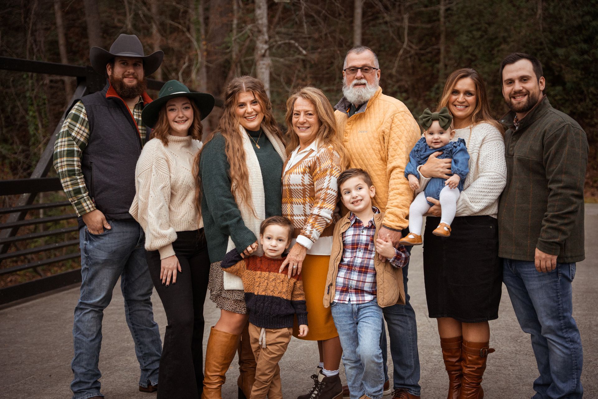 A large family is posing for a picture together.