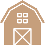 An icon of a barn with square windows and a door.