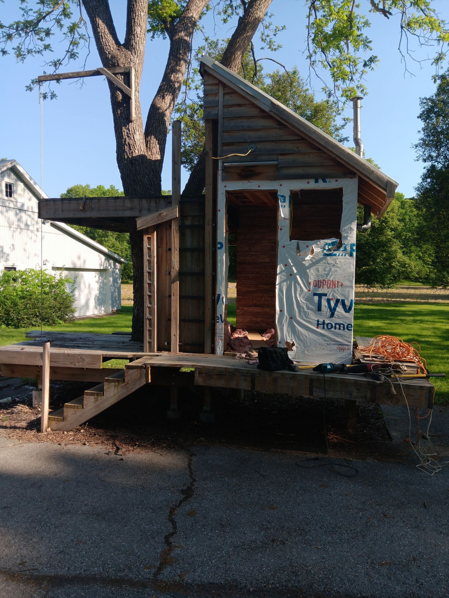 A small house is being built with tyvek insulation