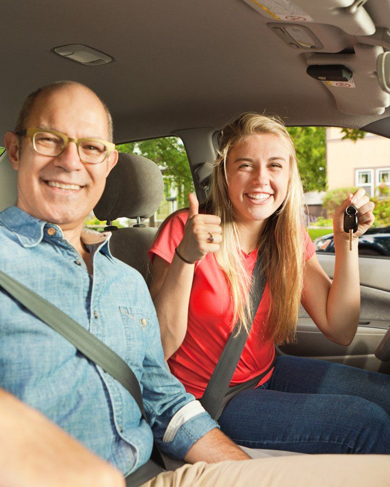 Driving Instructor and Happy Student Driver in Car - Northgate Driving School - Rochester, MN