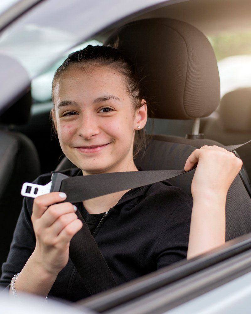 Teen Driver Fastening Seat Belt - Northgate Driving School - Rochester, MN