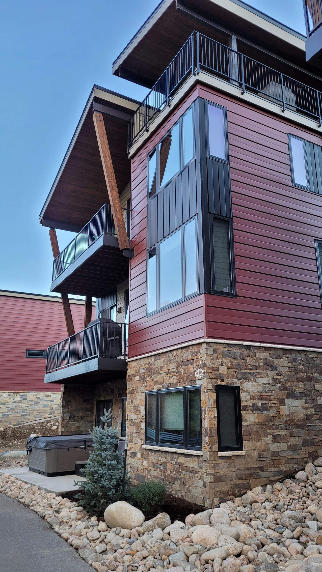 A large house with a hot tub in front of it.