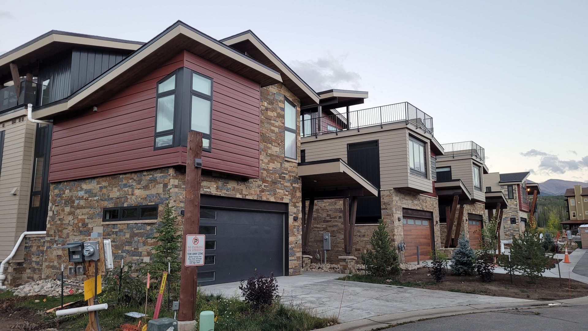 A row of houses with a no parking sign in front of them