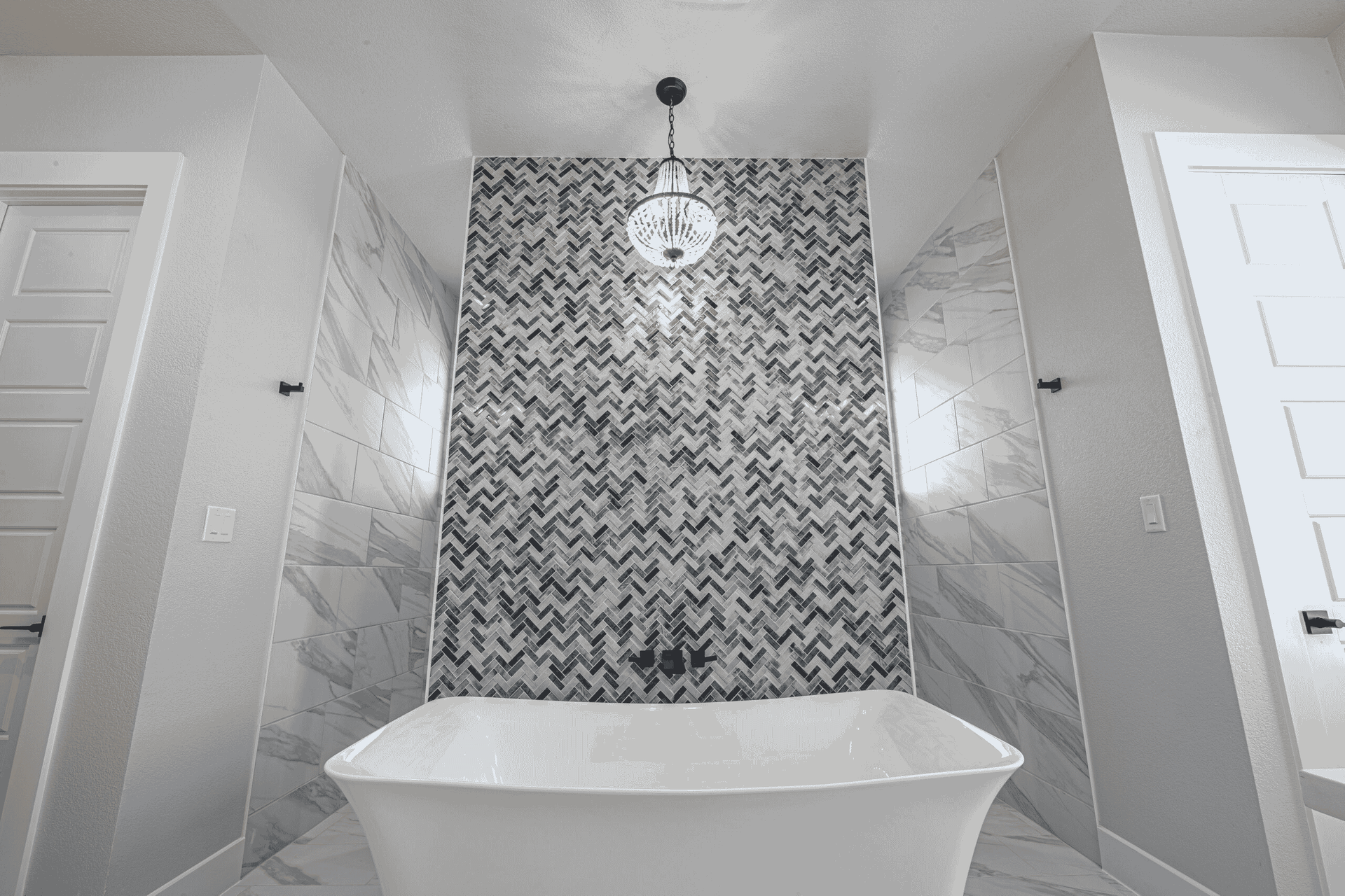 A bathroom with a bathtub and a shower stall.