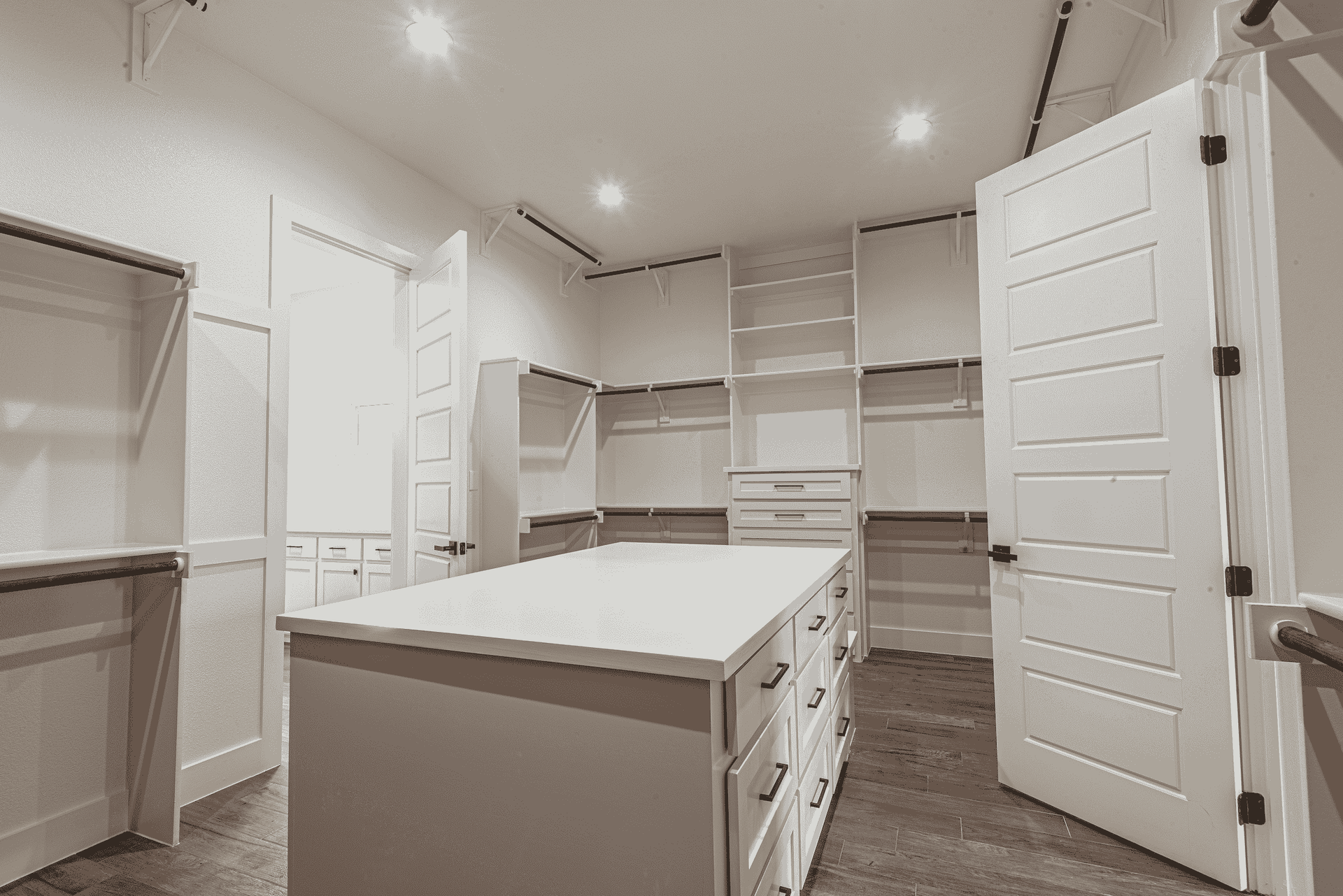 There is a large island in the middle of the walk in closet.