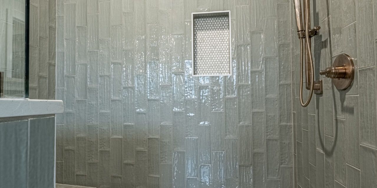 A bathroom with a walk in shower and a toilet.