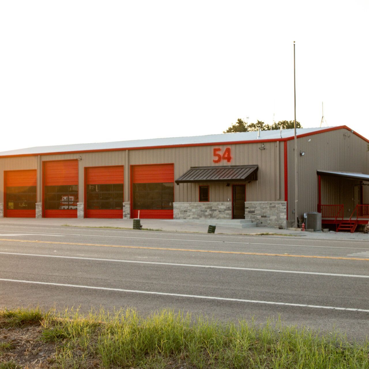 The number 54 is on the side of a building