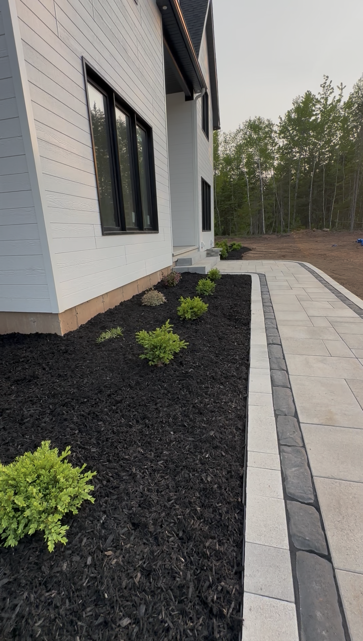 A large log cabin sitting on top of a lush green field.
