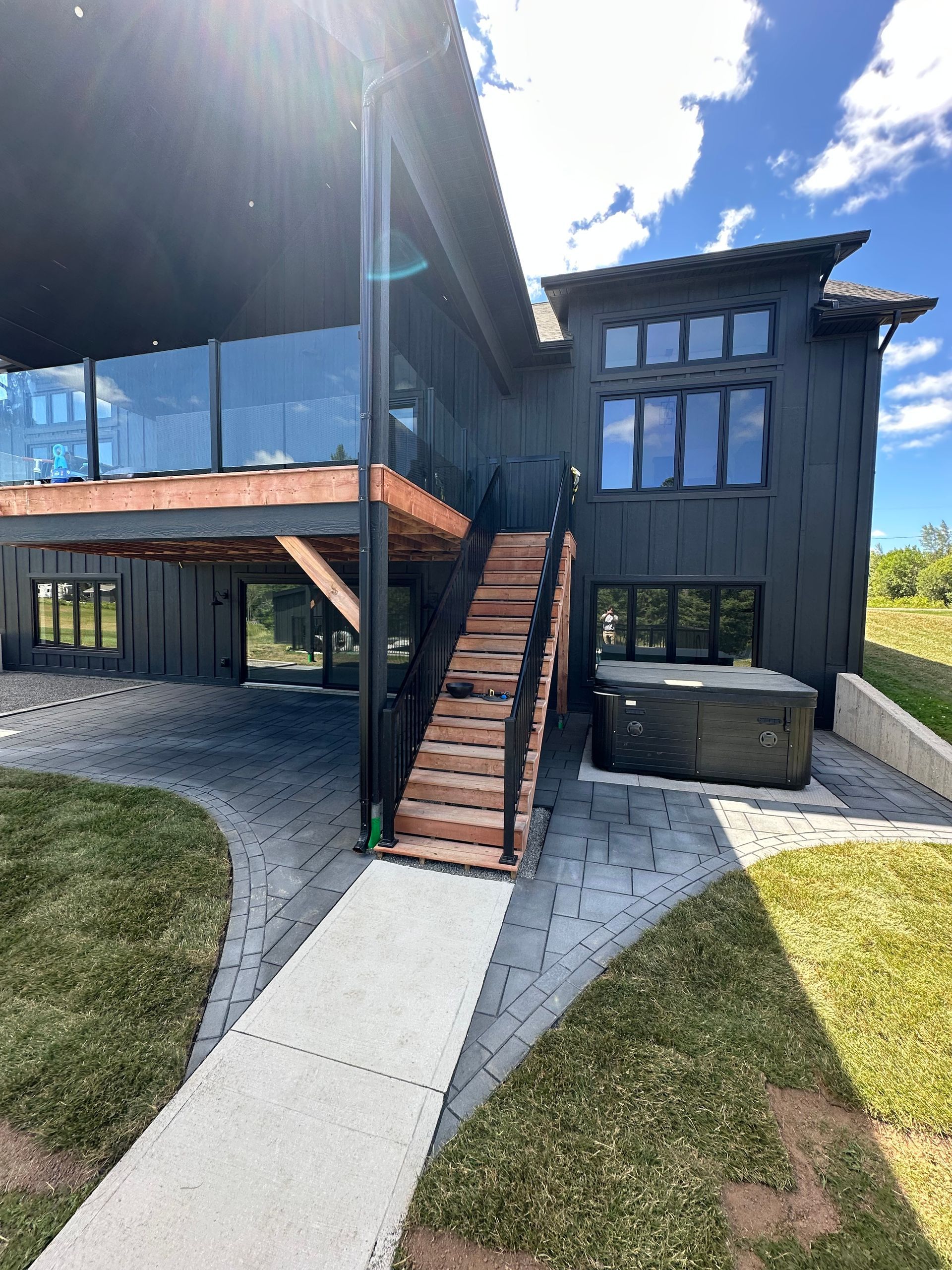 A large house with a lush green lawn in front of it