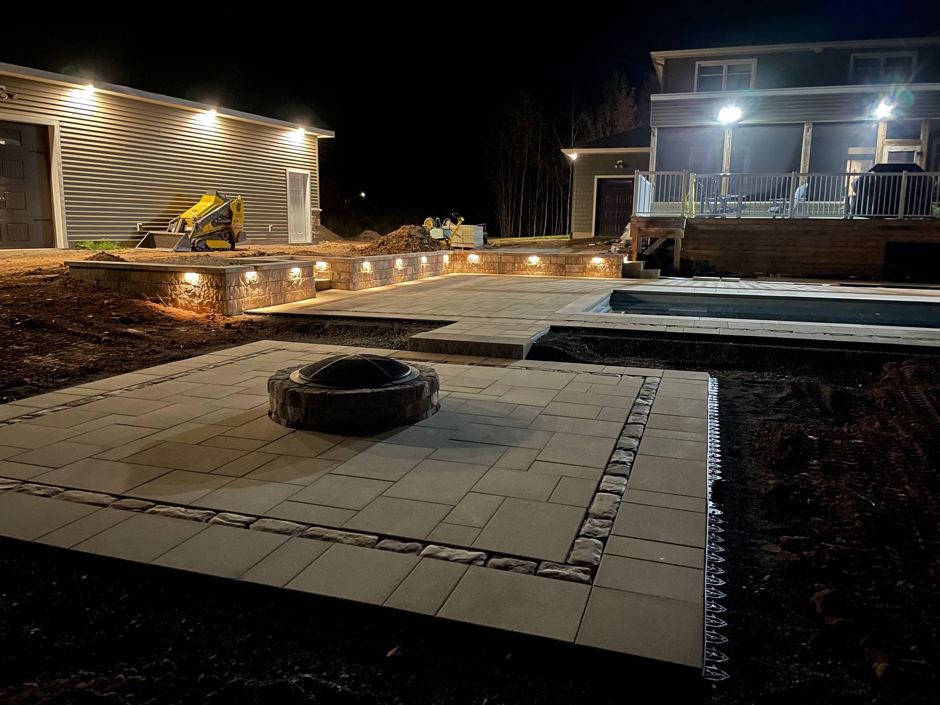 A brick wall with a tree in the background