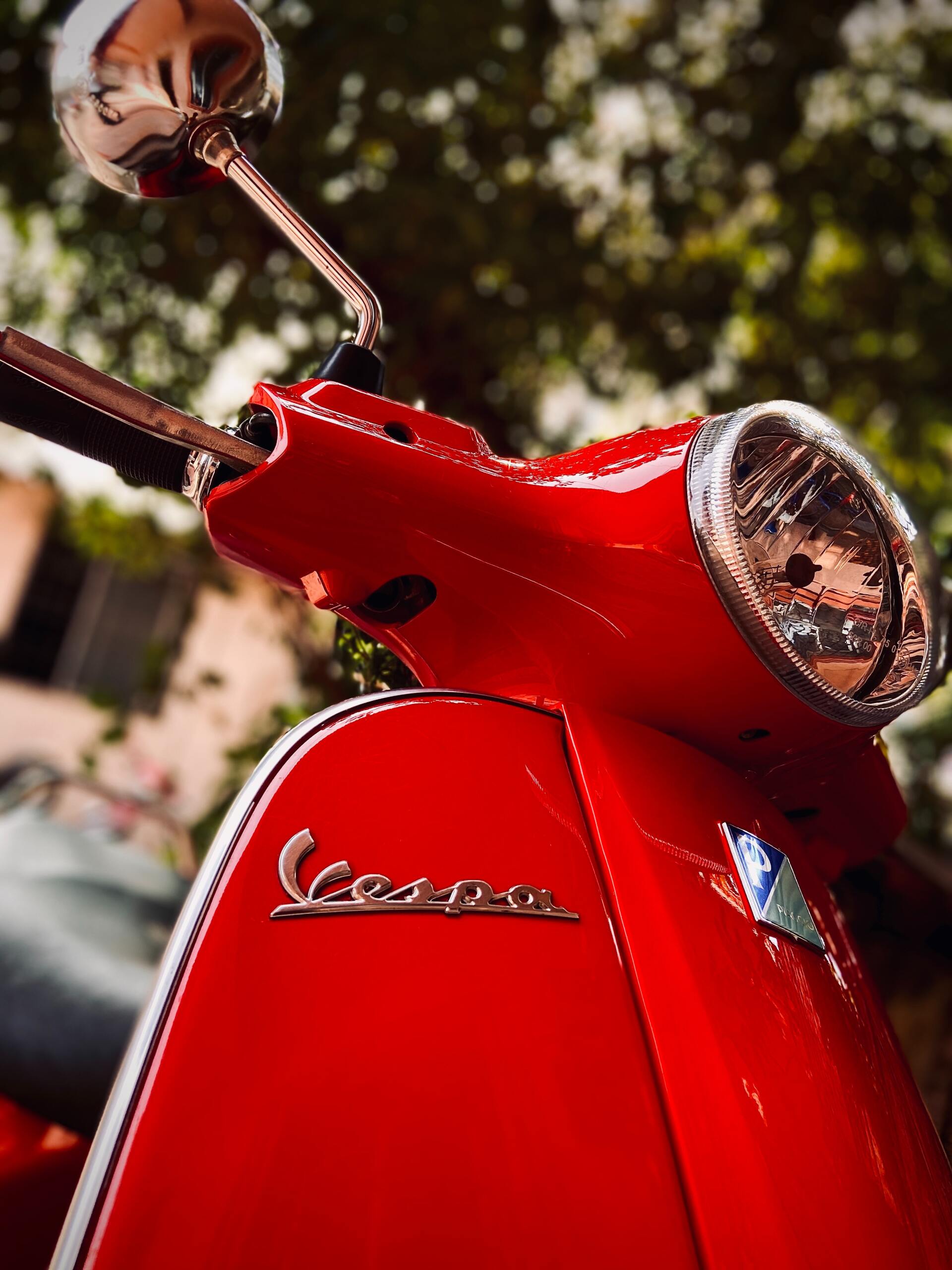 Low angle image of a red Vespa scooter