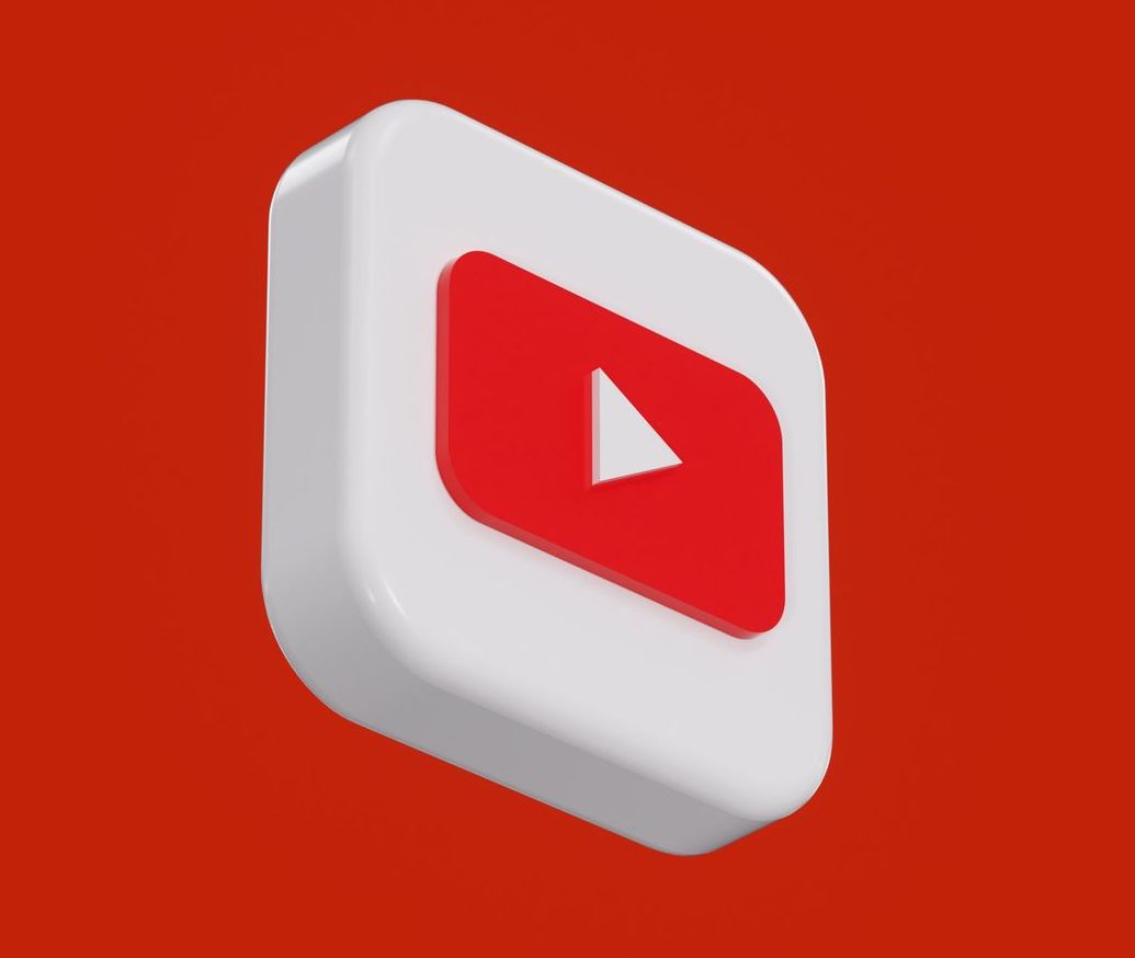 Red video play button over red background