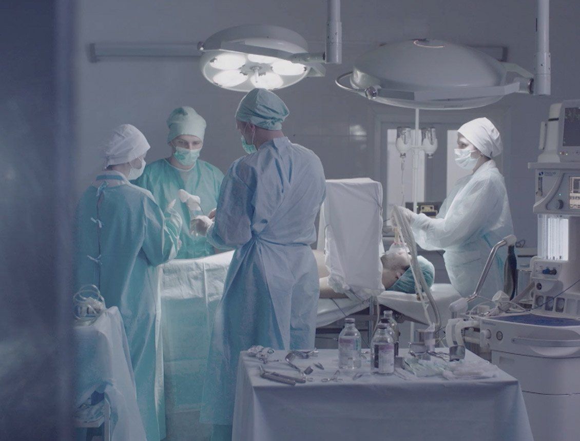 Image shows a surgery in progress at a hospital, from ASP's brand videos produced by Spin Creative.