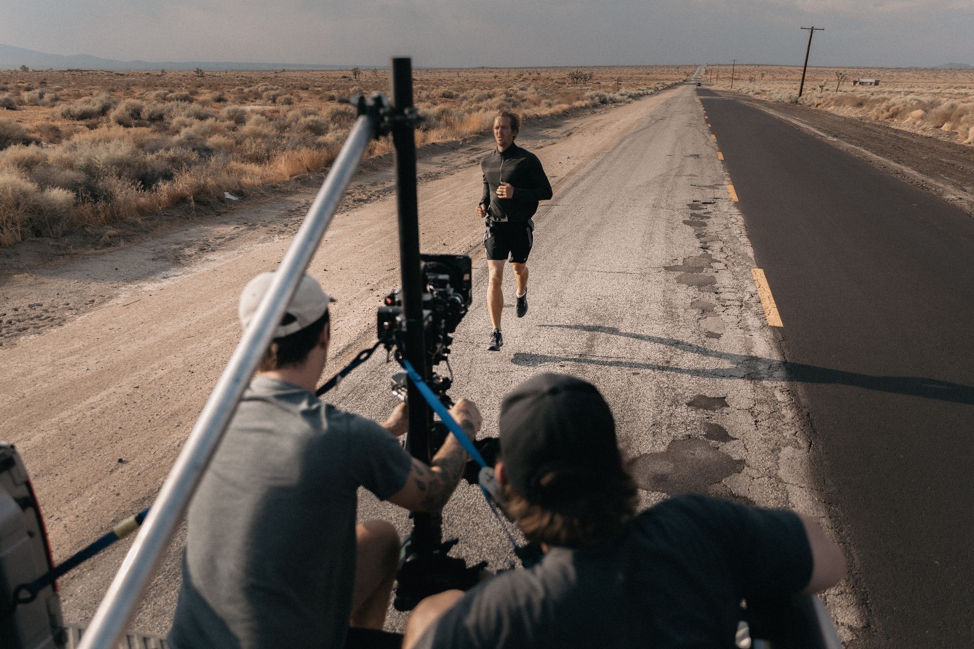 Film crew filming a man running