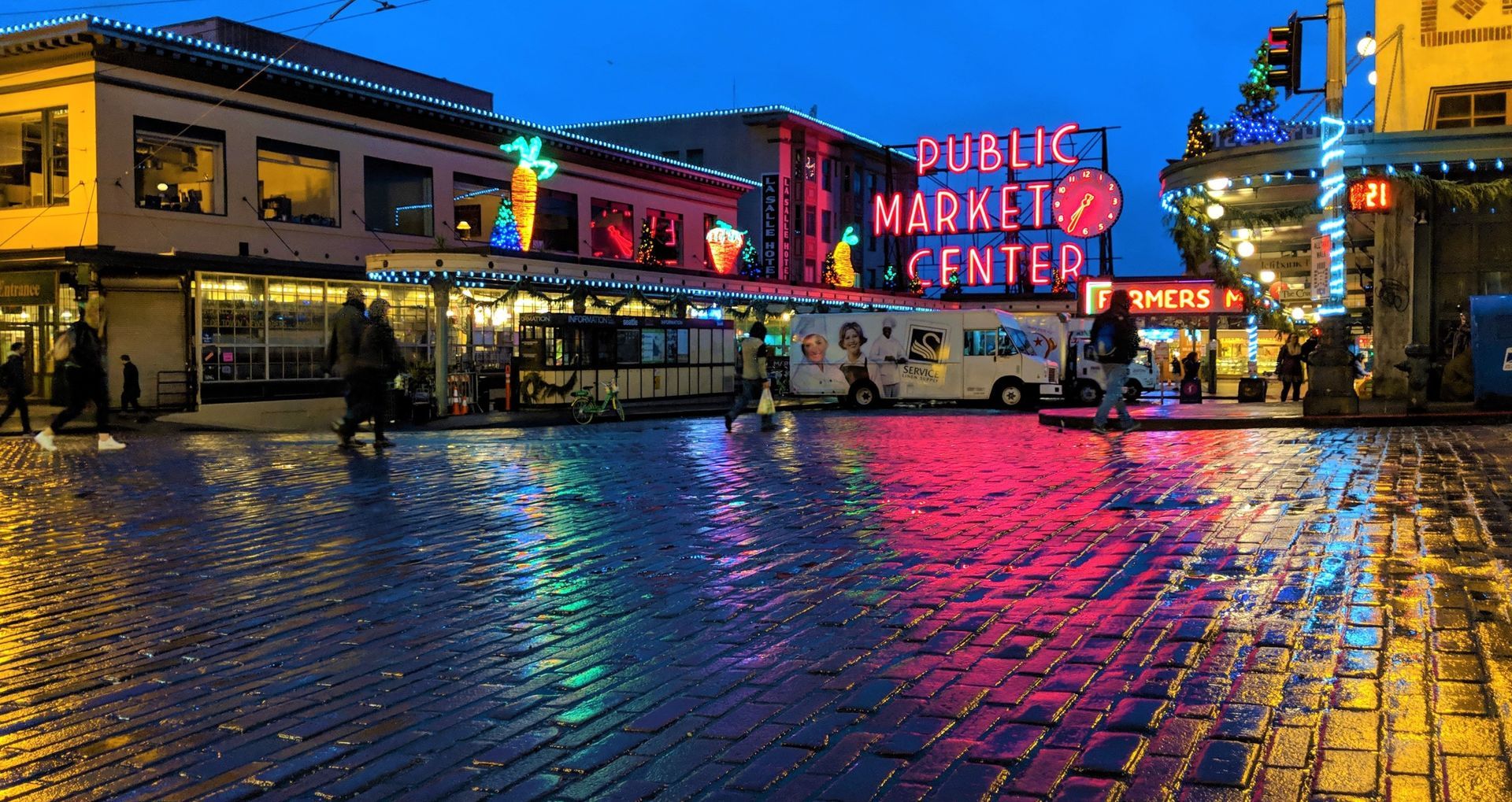 Pike Place Market Seattle at night with wet rainy street