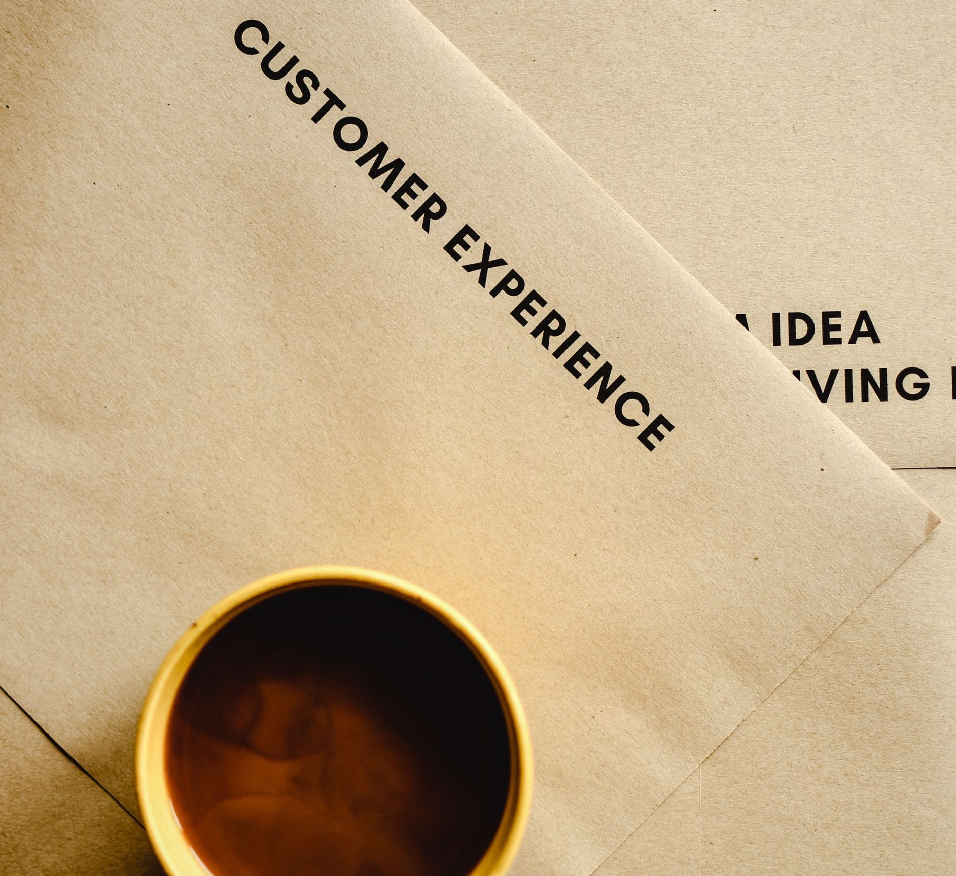 Customer experience printed on paper with coffee cup