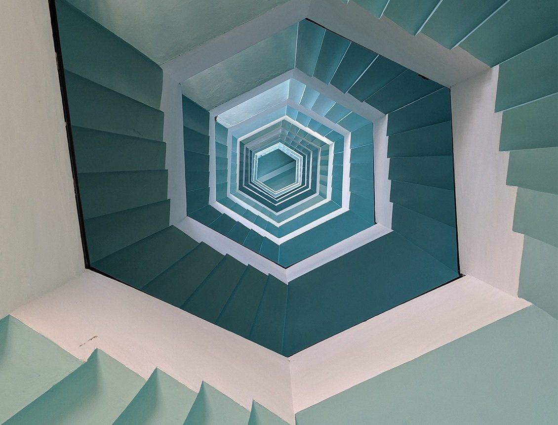 Spin Creative video production company, branding and design agency image of spiral stairwell.
