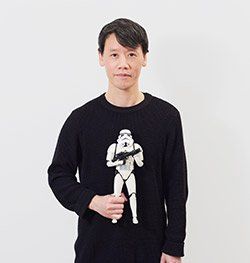 Hun Wynn headshot holding Star Wars Storm Trooper figurine for Spin Creative team page