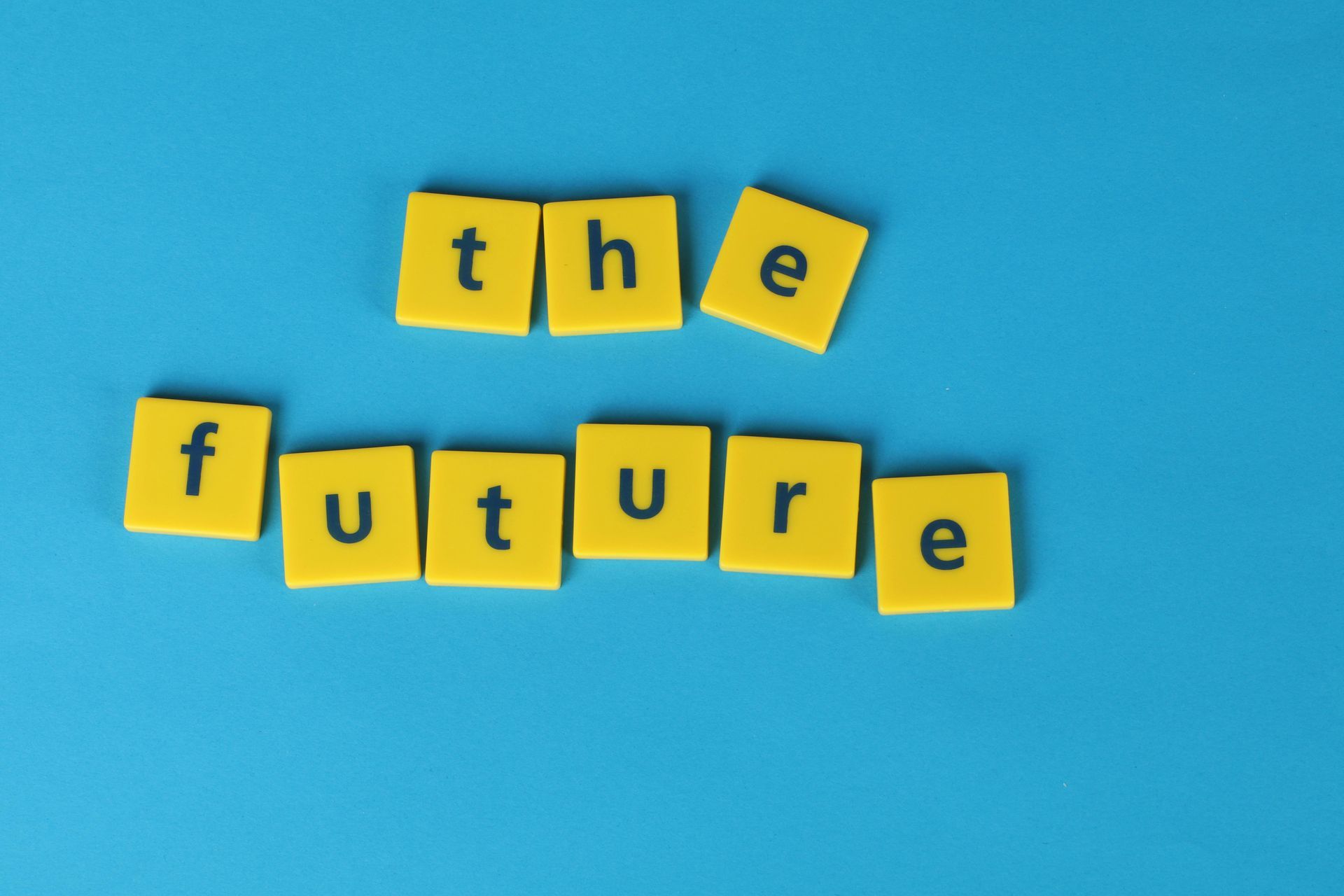 The word future is written in yellow blocks on a blue background The word future is written in yellow blocks on a blue background