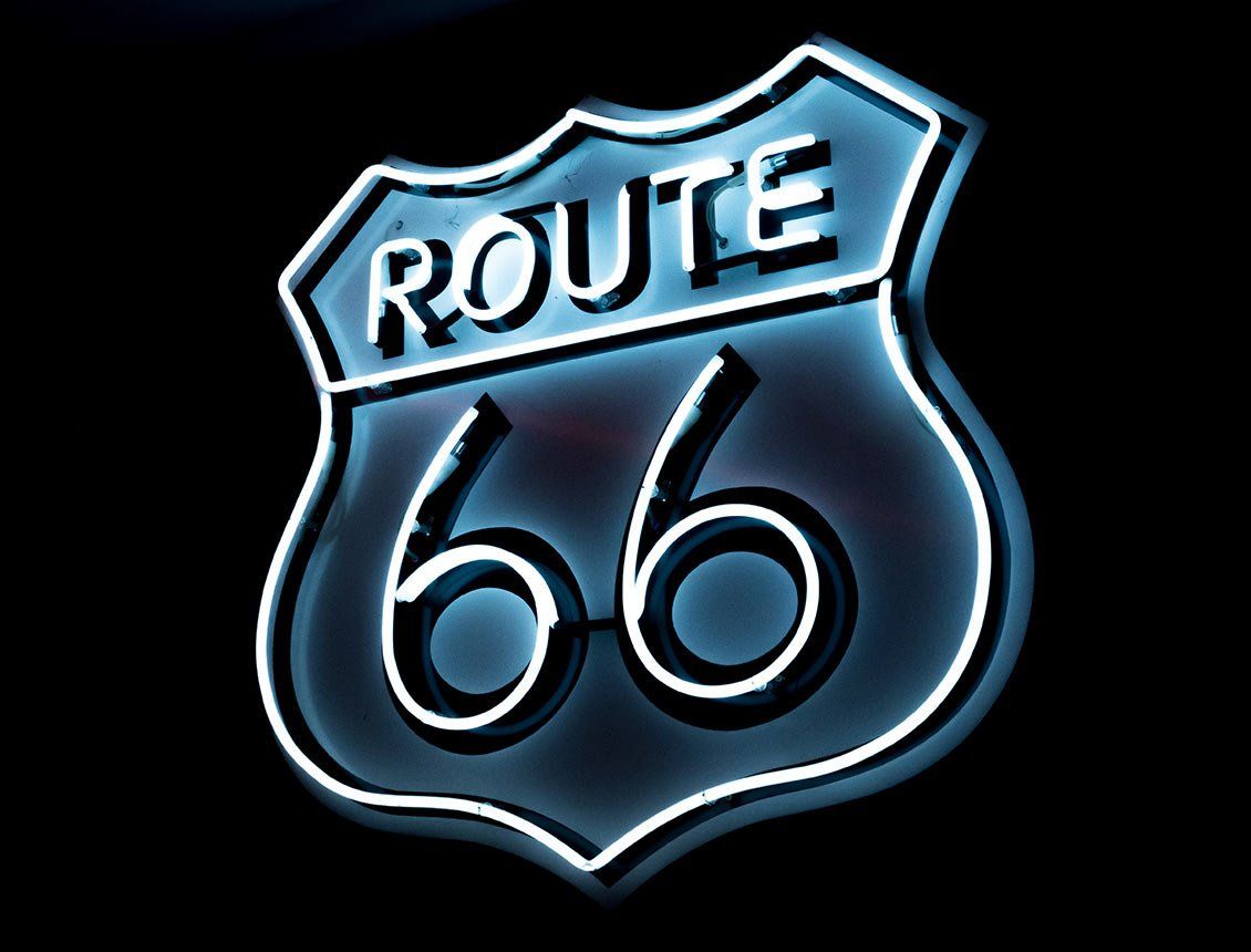 Image of Route 66 logo as a neon sign over black