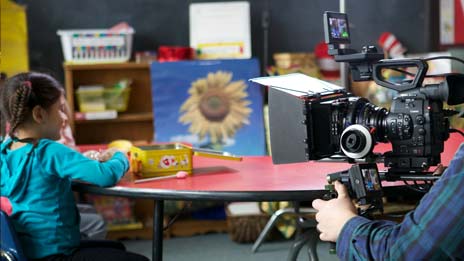 Spin Creative behind the scenes photo Treehouse brand video tv commercial shoot girl sitting in classroom