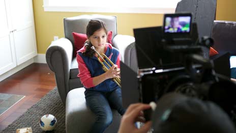 Spin Creative behind the scenes photo Treehouse brand video tv commercial shoot girl playing trumpet