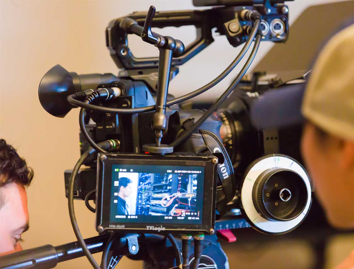 Behind the scenes of a Spin Creative video production shoot featuring a Canon C300 cinema camera rig.