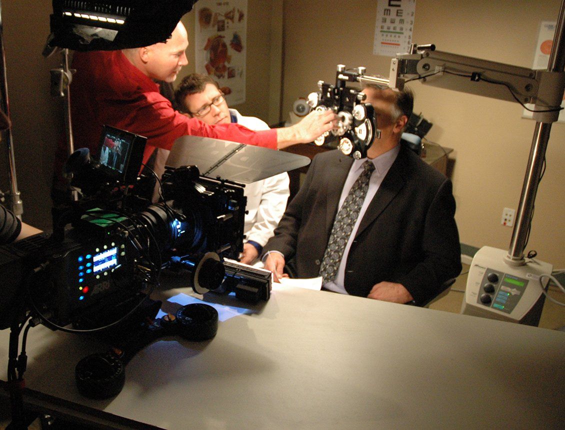 Behind the scenes image of a Spin Creative video marketing shoot on location at an eye doctor's office.