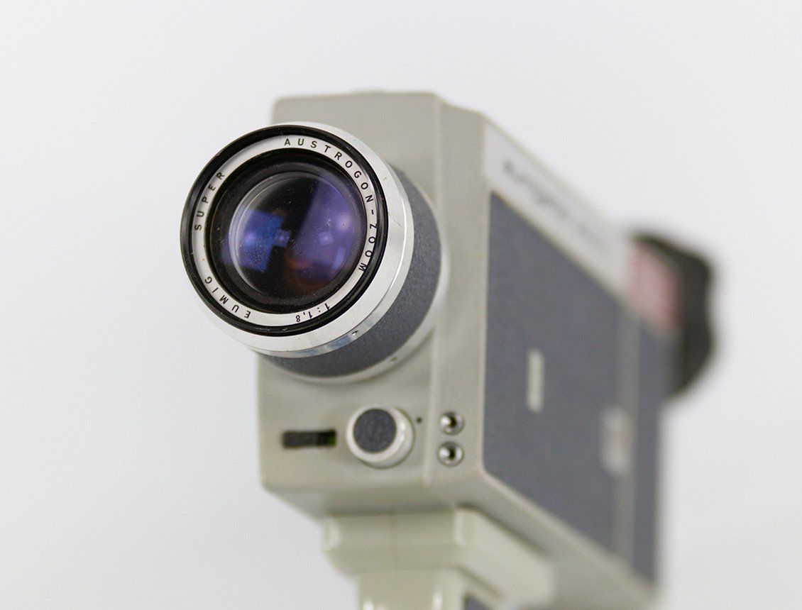 Close up image of an old school hand held film Super 8 cinema camera