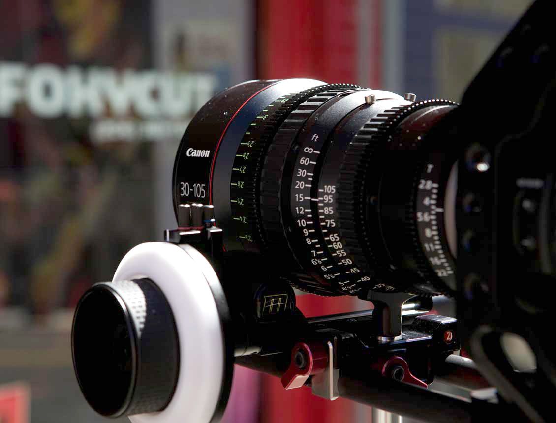 Behind the scenes photo of Seattle video production company Spin Creative shoot showing a Canon 30-105 cinema zoom lens on a C300 camera.