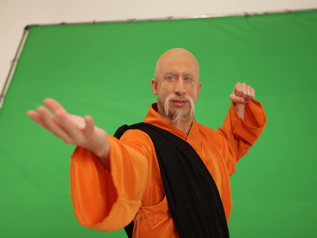 Behind the scenes at Spin Creative green screen video shoot actor in Kung Fu make up