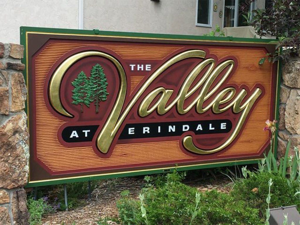 Carved dimensional sign with gold leaf