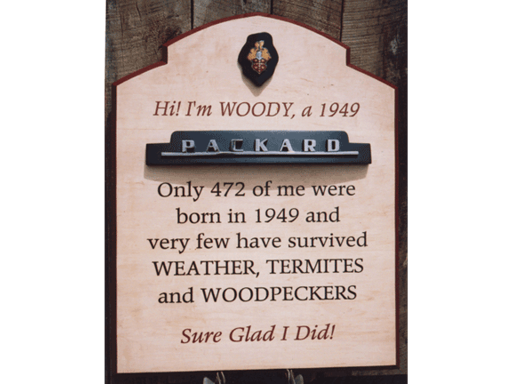 Plaque with metal ornaments attached for an antique auto